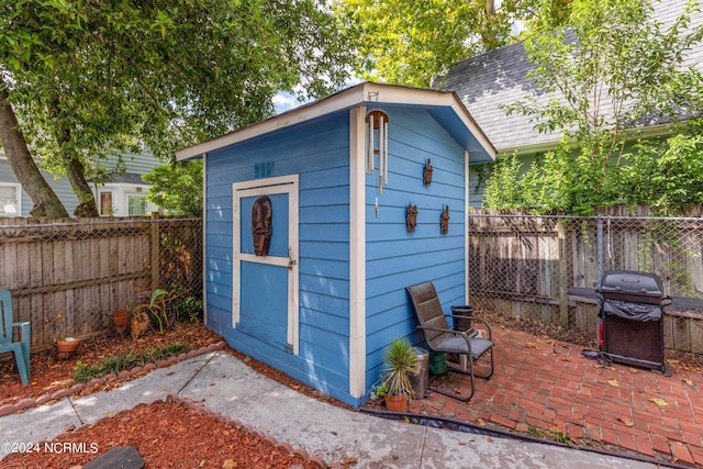 view of shed featuring a fenced backyard