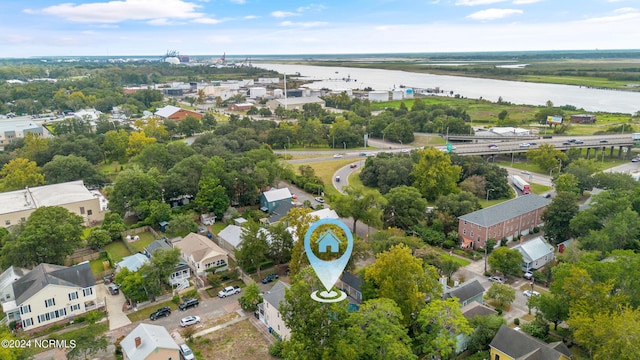 birds eye view of property with a water view and a residential view