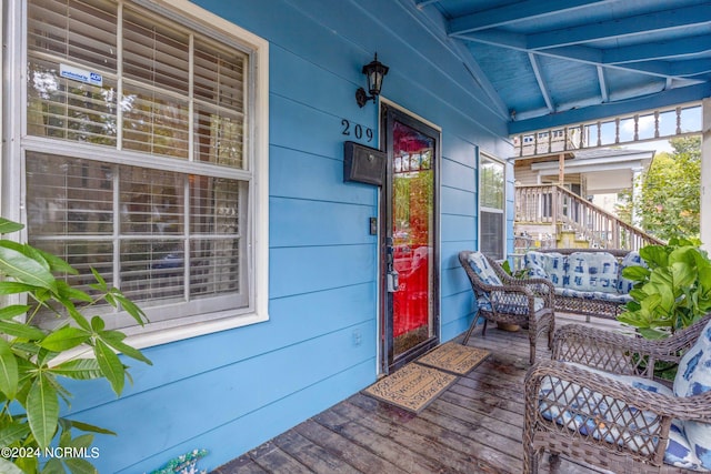 wooden terrace featuring a porch