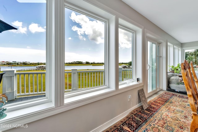 sunroom with a water view