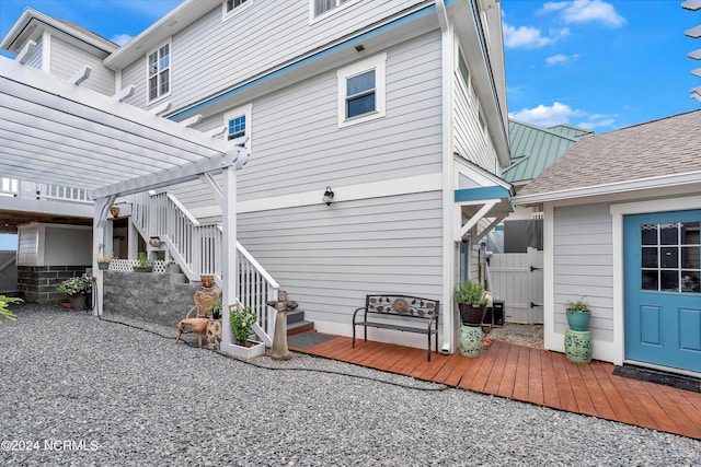 back of house featuring a pergola and a deck