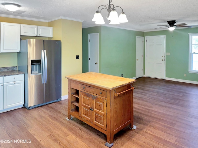 kitchen featuring light wood-type flooring, ceiling fan with notable chandelier, white cabinetry, a textured ceiling, and stainless steel refrigerator with ice dispenser