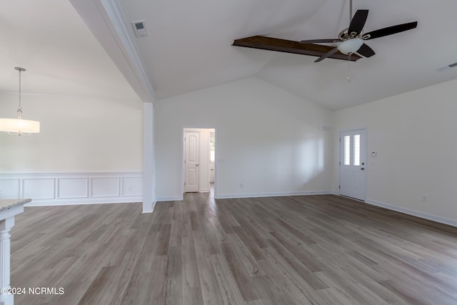 unfurnished living room with light wood-type flooring, ceiling fan, and high vaulted ceiling