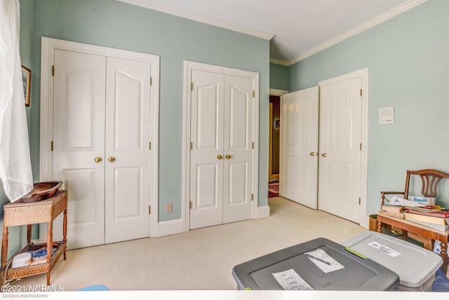 carpeted home office featuring ornamental molding