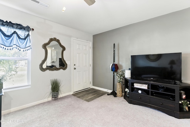 foyer featuring carpet floors, visible vents, and baseboards