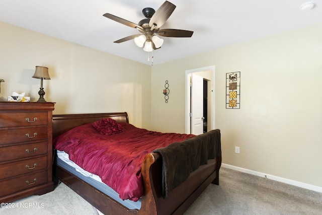 bedroom with baseboards, a ceiling fan, and light colored carpet