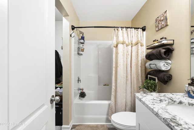 bathroom with vanity, toilet, and shower / bath combo with shower curtain