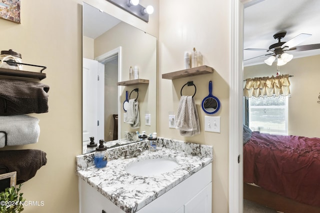 bathroom with a ceiling fan and vanity