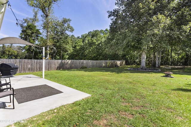 view of yard with a patio area and fence