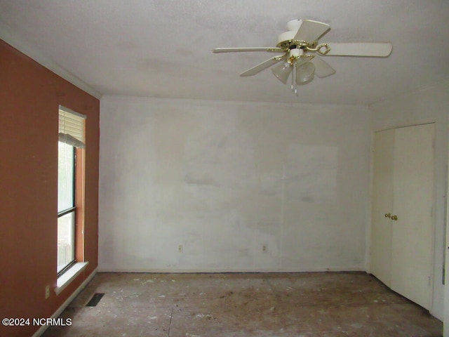 spare room with ceiling fan