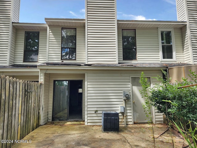 back of property featuring central air condition unit