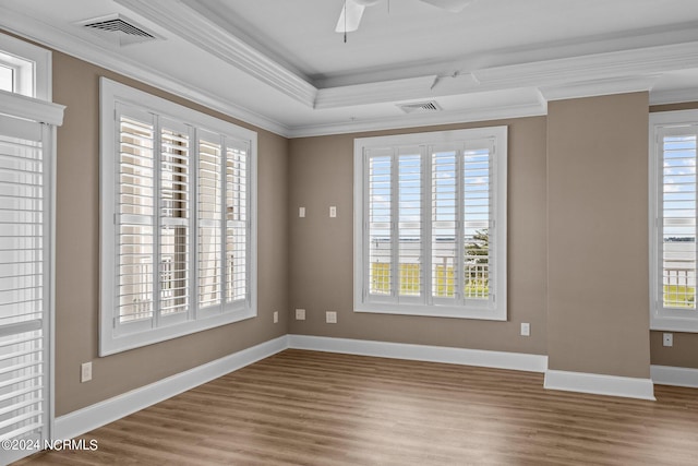 empty room featuring hardwood / wood-style flooring and a wealth of natural light