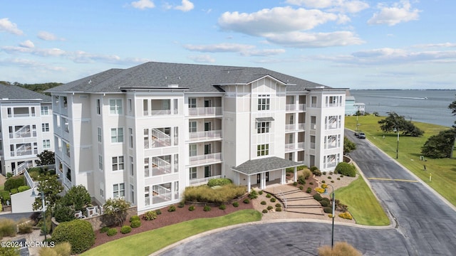 view of building exterior with a water view