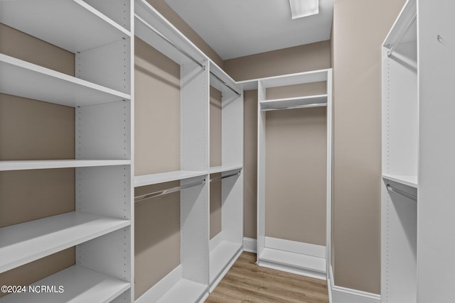 spacious closet with light wood-type flooring