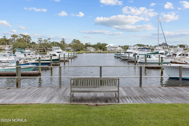 dock area featuring a water view and a yard