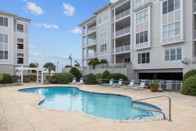 view of pool featuring a patio