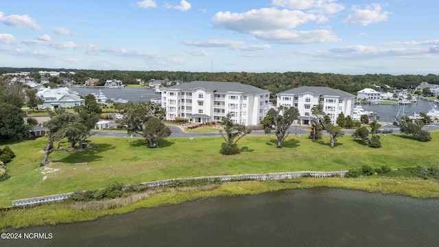 birds eye view of property with a water view