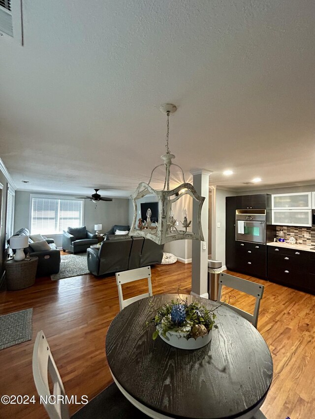 dining area featuring ceiling fan and hardwood / wood-style flooring