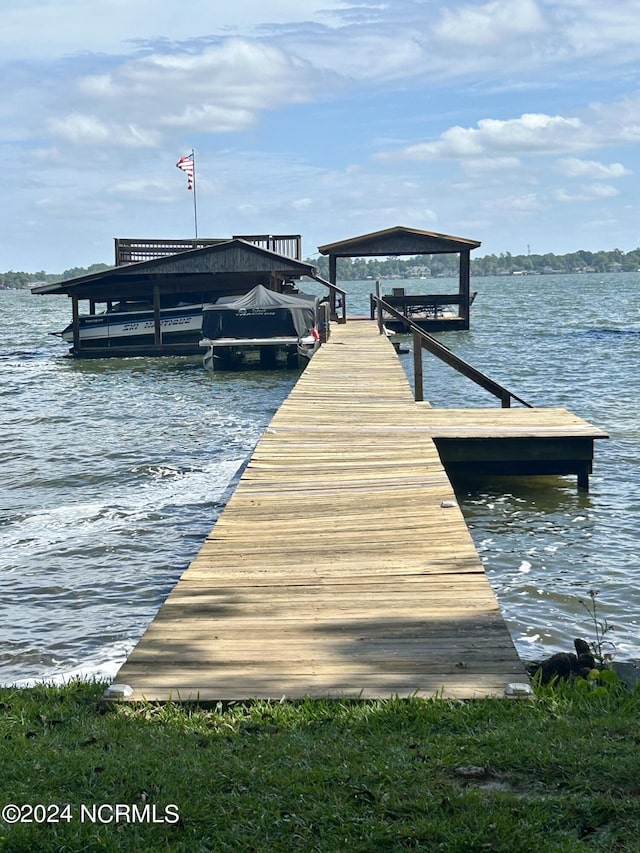 view of dock with a water view and boat lift