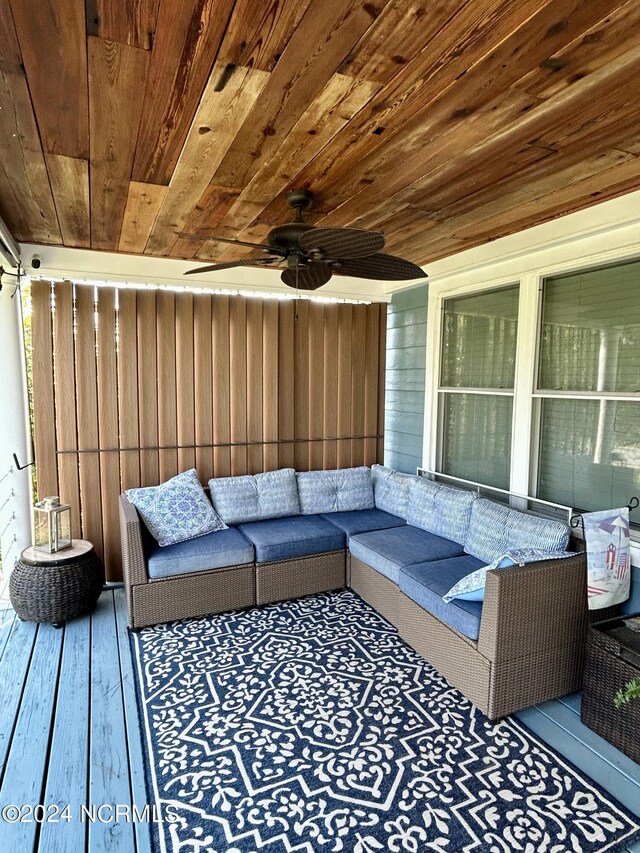 exterior space featuring ceiling fan and an outdoor hangout area