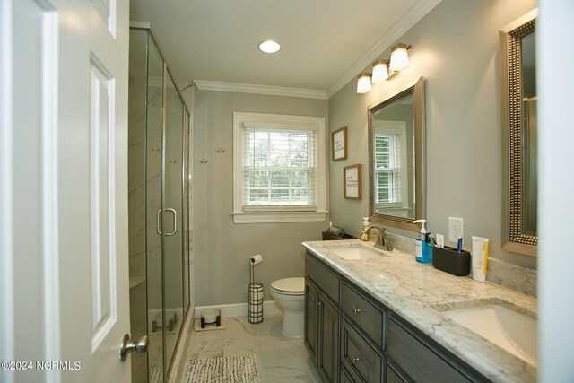 full bathroom featuring a sink, baseboards, marble finish floor, ornamental molding, and a shower stall