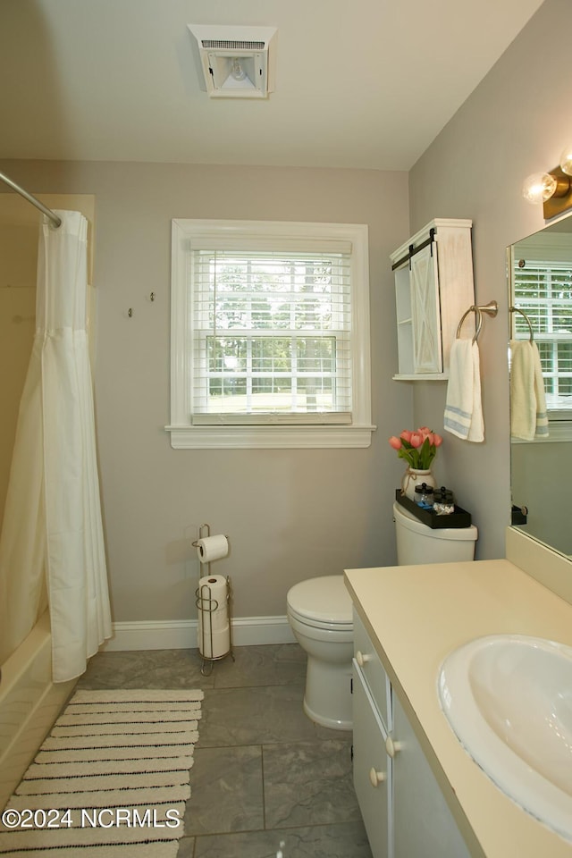 full bathroom featuring toilet, vanity, visible vents, baseboards, and shower / bath combination with curtain