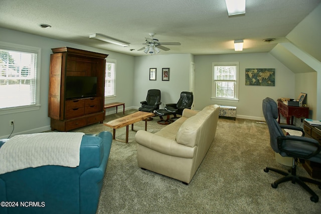 carpeted living area featuring a textured ceiling, a ceiling fan, visible vents, and baseboards