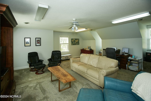 living area featuring lofted ceiling, carpet flooring, visible vents, and a textured ceiling