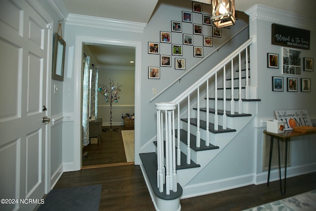 staircase with baseboards, wood finished floors, and crown molding