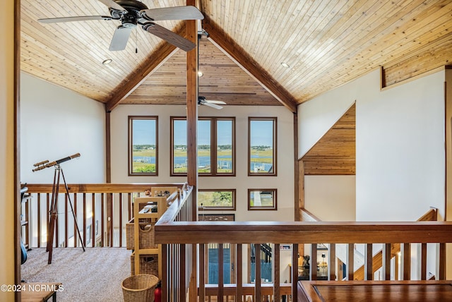 hallway with beam ceiling, high vaulted ceiling, carpet flooring, and wood ceiling