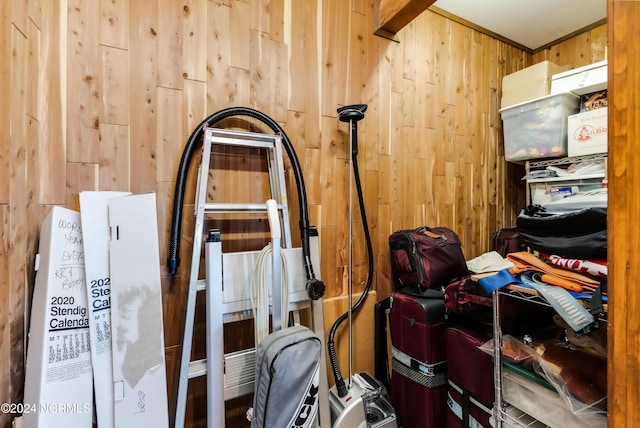 misc room featuring wooden walls