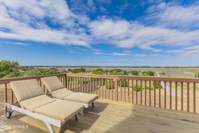 deck featuring a water view