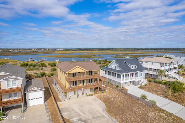 bird's eye view with a residential view and a water view