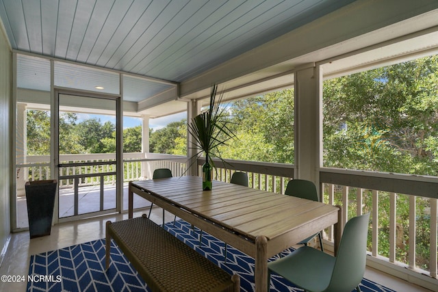 sunroom / solarium featuring plenty of natural light