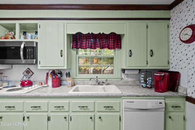 kitchen with green cabinets, white appliances, ornamental molding, and sink