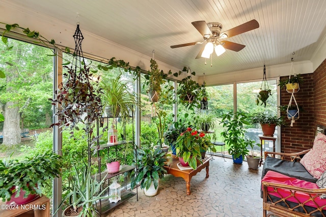 sunroom with ceiling fan, baseboard heating, and wooden ceiling