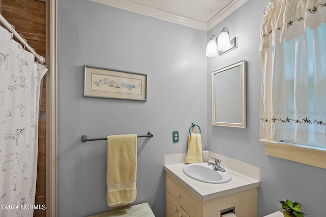 bathroom with a shower with curtain, vanity, and crown molding