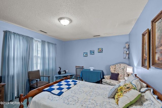 bedroom featuring a textured ceiling