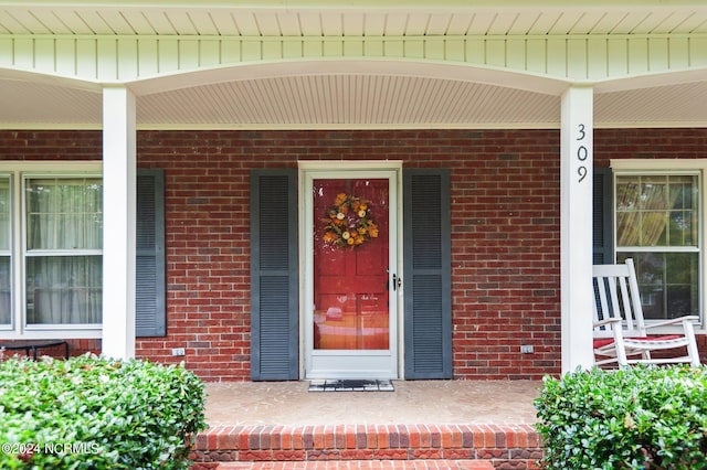 doorway to property with covered porch