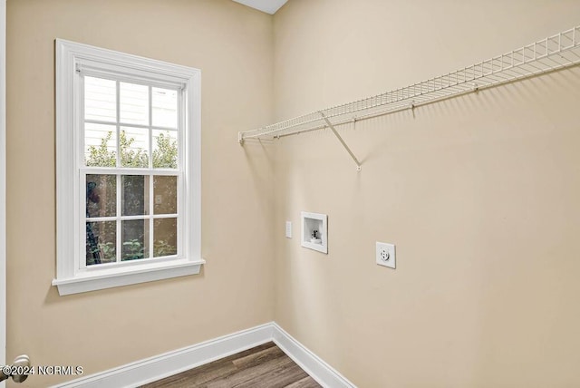 5104 Boss Ct SE, Southport, NC 28461 - washroom featuring washer hookup, baseboards, hookup for an electric dryer, and dark wood-style flooring