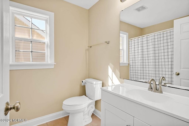 5104 Boss Ct SE, Southport, NC 28461 - full bathroom featuring baseboards, healthy amount of natural light, toilet, and vanity