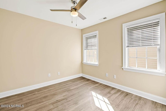 5104 Boss Ct SE, Southport, NC 28461 - unfurnished room with a ceiling fan, light wood-style flooring, and baseboards