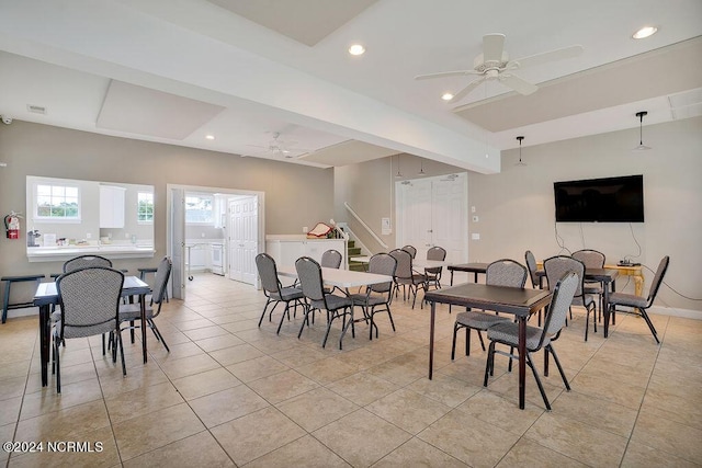5104 Boss Ct SE, Southport, NC 28461 - dining room with ceiling fan, light tile patterned flooring, recessed lighting, and stairway