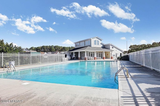 5104 Boss Ct SE, Southport, NC 28461 - community pool featuring a patio