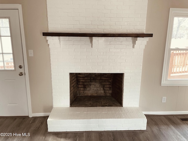 room details featuring hardwood / wood-style floors and a fireplace