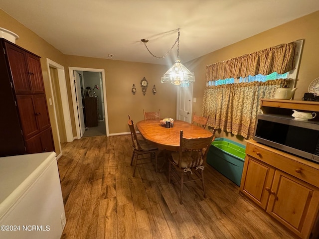 dining area with hardwood / wood-style flooring