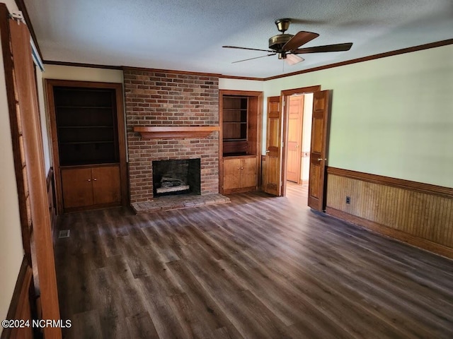 unfurnished living room with ceiling fan, a textured ceiling, wood walls, and dark hardwood / wood-style flooring