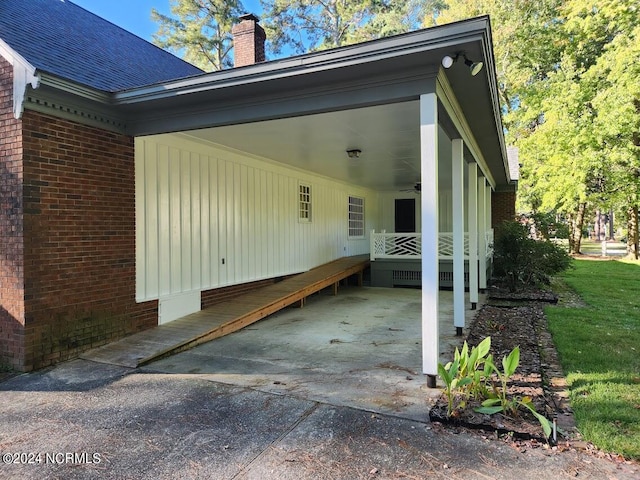 view of home's exterior with a carport