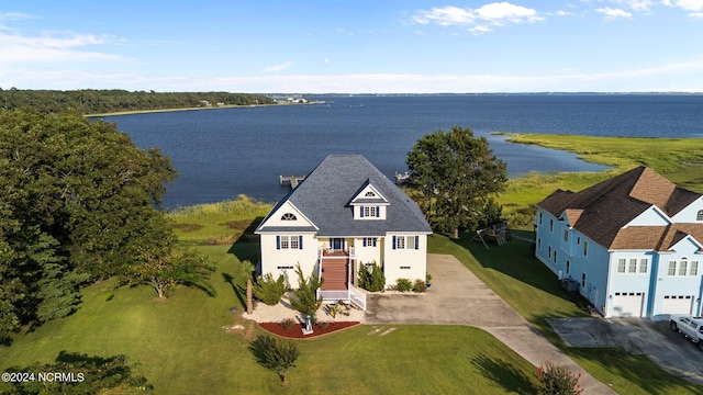 birds eye view of property with a water view