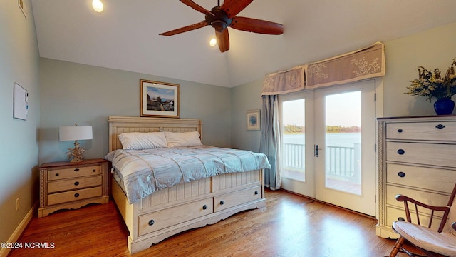 bedroom with hardwood / wood-style flooring, french doors, lofted ceiling, access to exterior, and ceiling fan